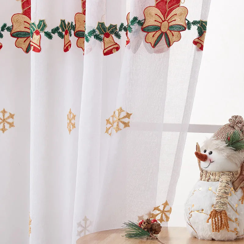 Pair of American-style Christmas curtains with white snowflake embroidery on red fabric, hanging as a semi-sunshade window covering.