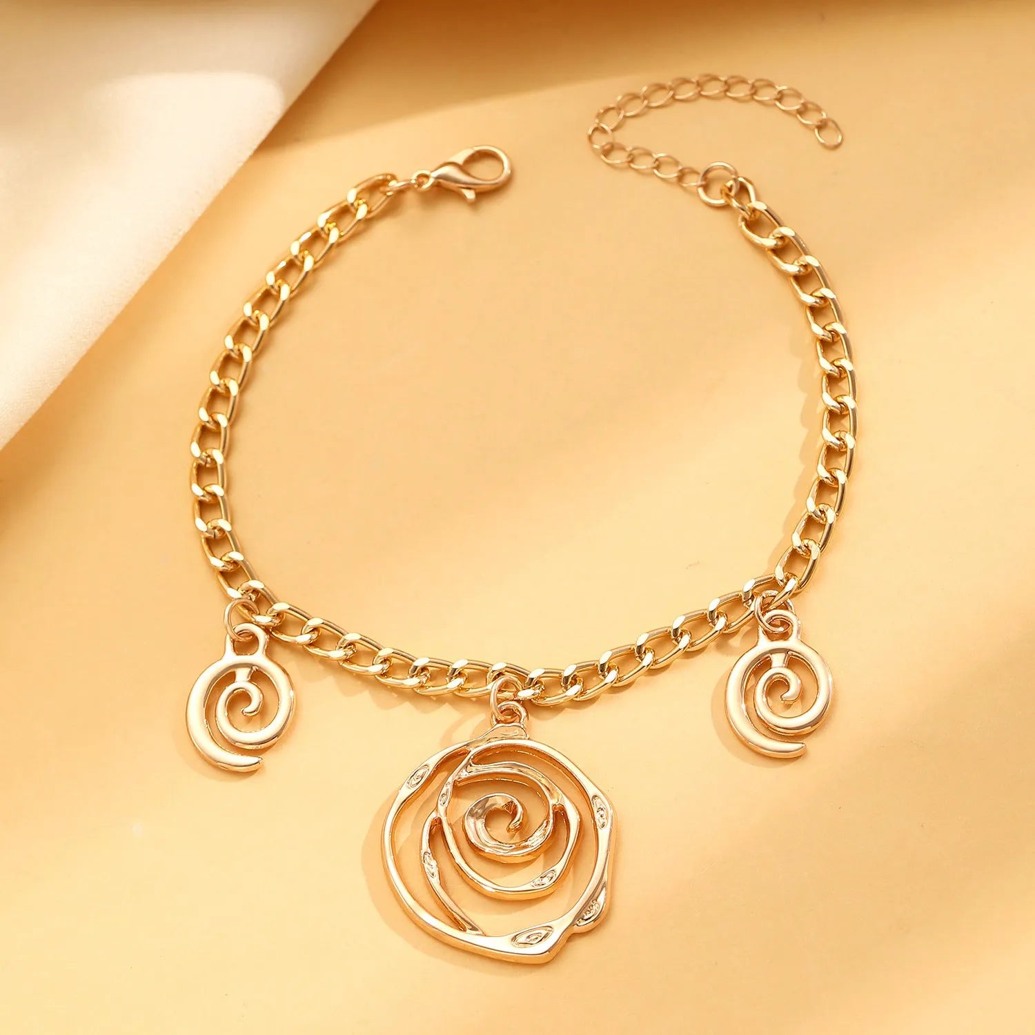 Spiral donut geometric jewellery set with necklace bracelet earrings in gold finish