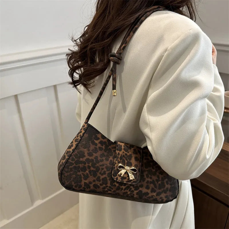 Women's casual large black PU shoulder bag with a sandwich pocket, shown next to brown and khaki colour options.