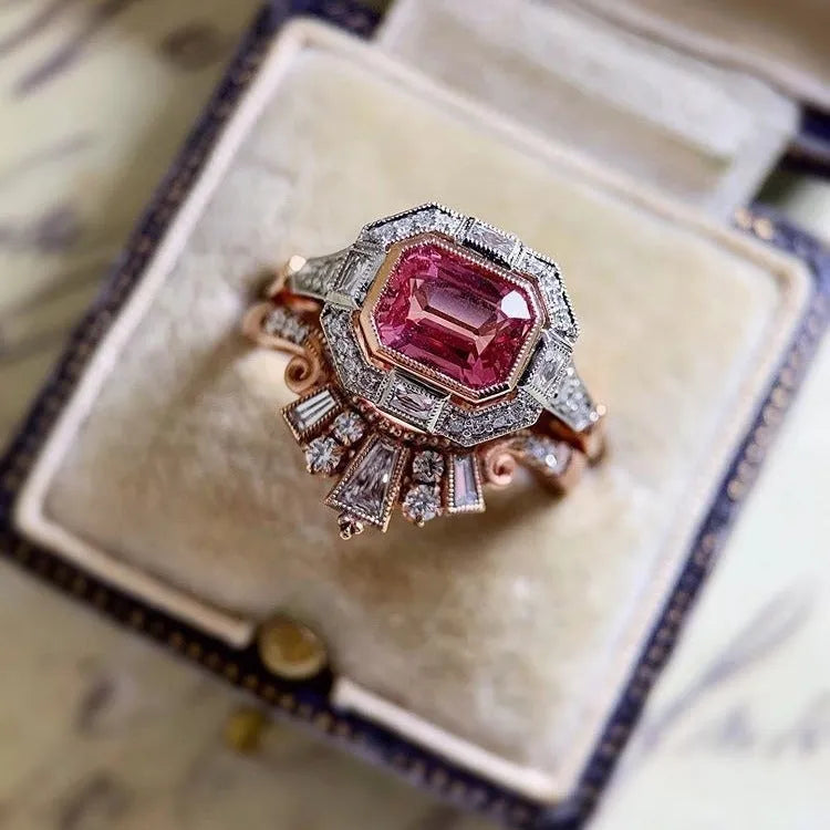 Rose gold colour women's fashion ring with geometric shape and ruby design elements in retro style