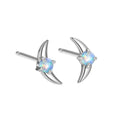Close-up of women's geometric earrings in 925 silver with electroplated finish and a blue crystal stone.