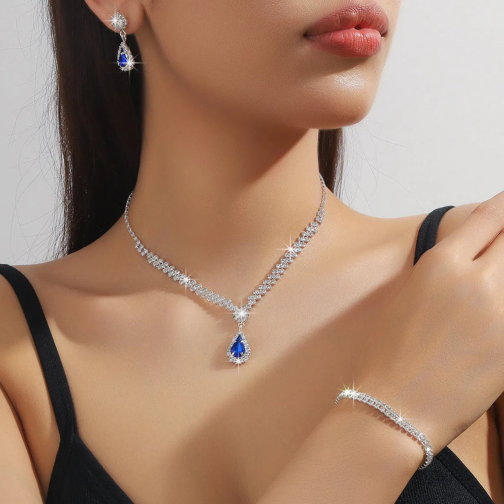 Claw chain rhinestone jewellery set with water drop shaped necklace and matching earrings in blue, green, pink, red, or white