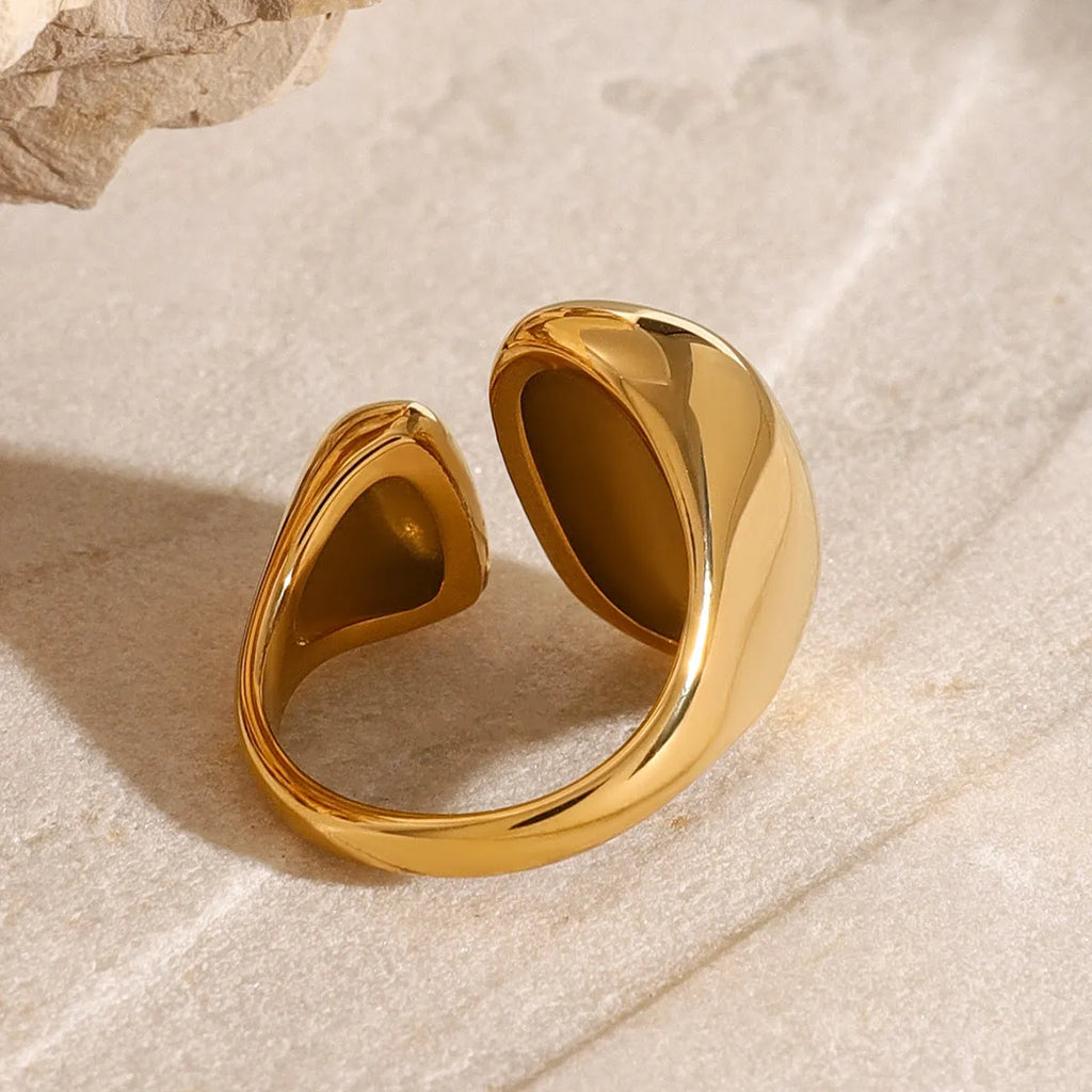 Exaggerated geometric stainless steel open ring for women with electroplated finish.
