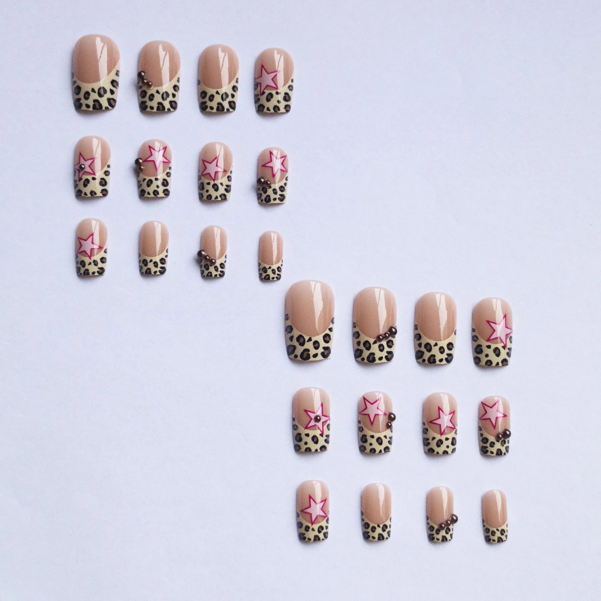 Wear Armor French leopard print five-pointed star press-on nails with pearl and diamond accents