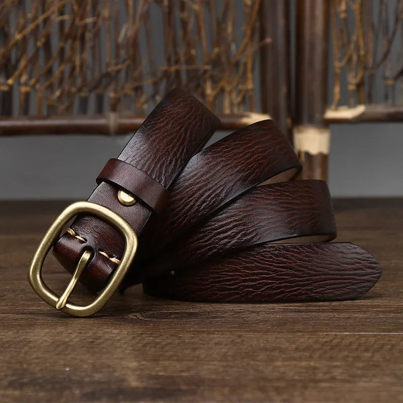 Handmade vintage copper buckle genuine leather belt in brown, 2.8cm wide, with pin buckle fastening on a neutral background
