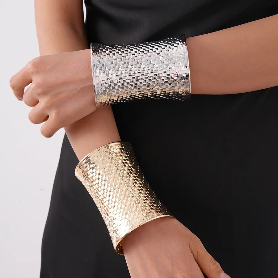 Women's vintage exaggerated round metal bracelet in gold finish with electroplated surface