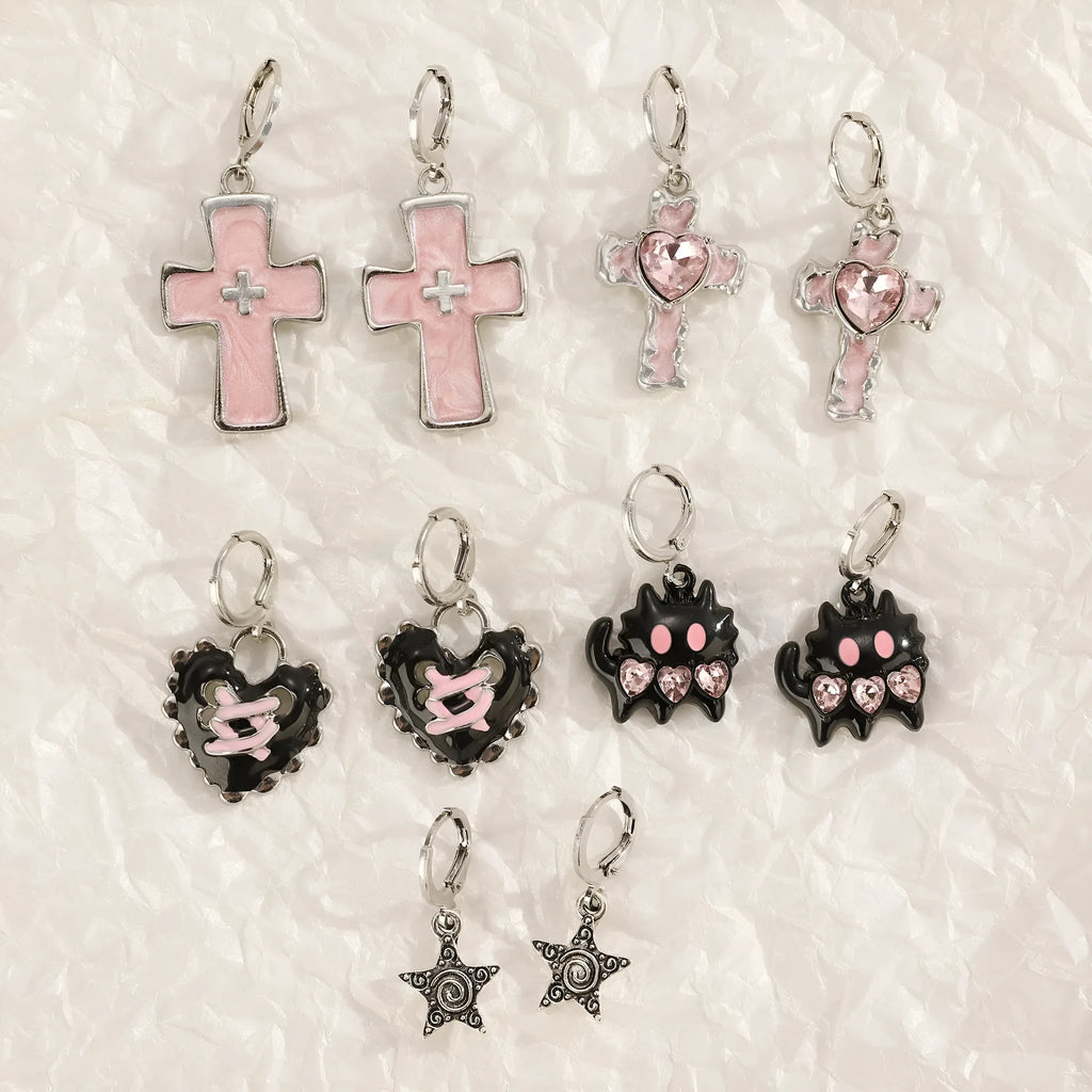 Women's alloy earrings with cross and character designs in five colour options including white cross and antique silver