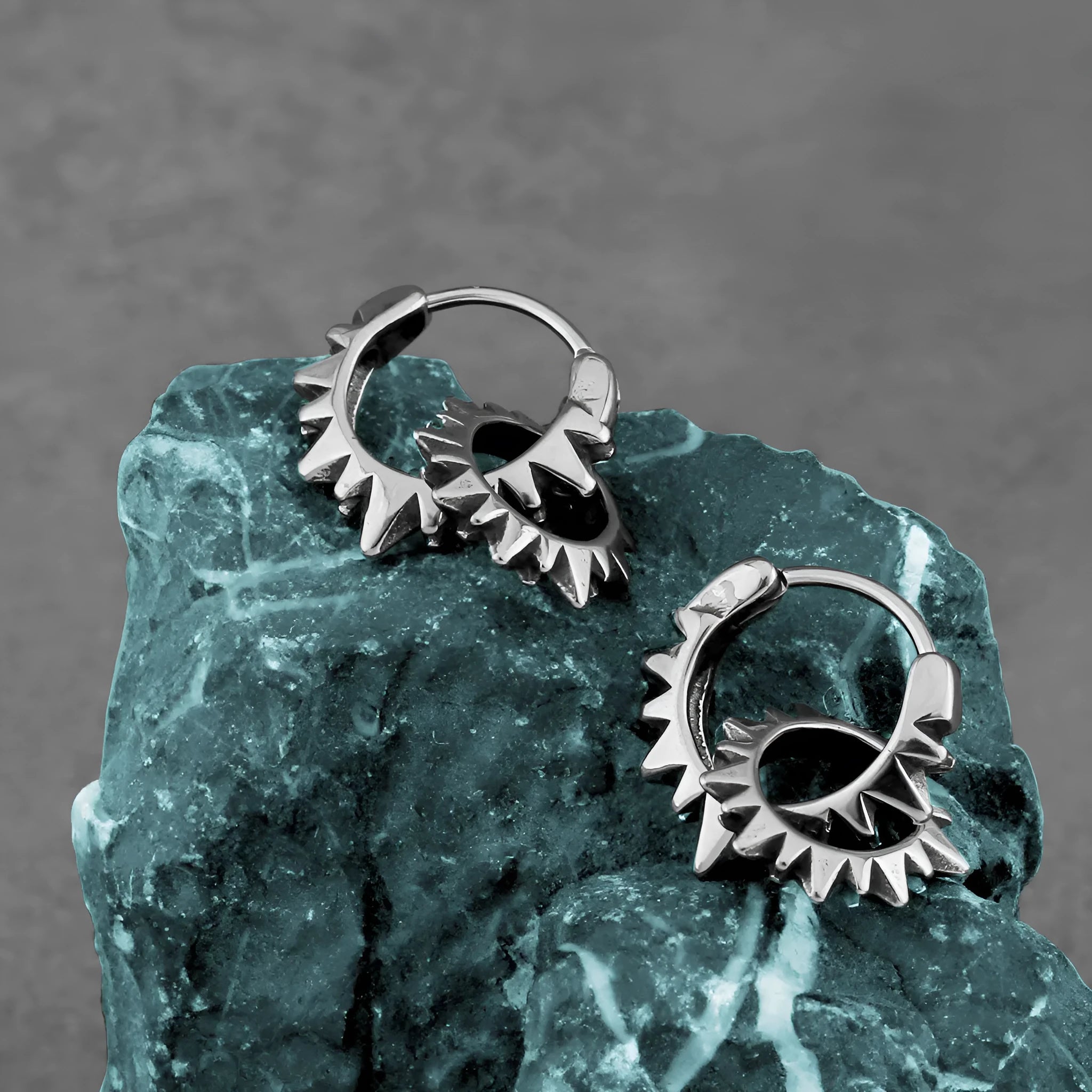 Stainless steel round ring earrings with polished steel finish and retro design