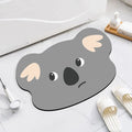 Diatomaceous earth bathroom absorbent mat with cartoon animal design in bathroom setting