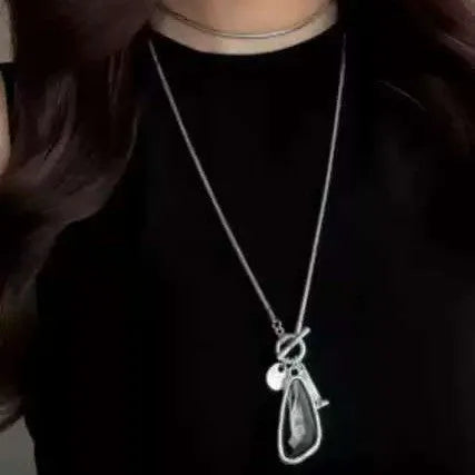 Geometric alloy pendant necklace with snake bones chain in blue, champagne, and grey colour options