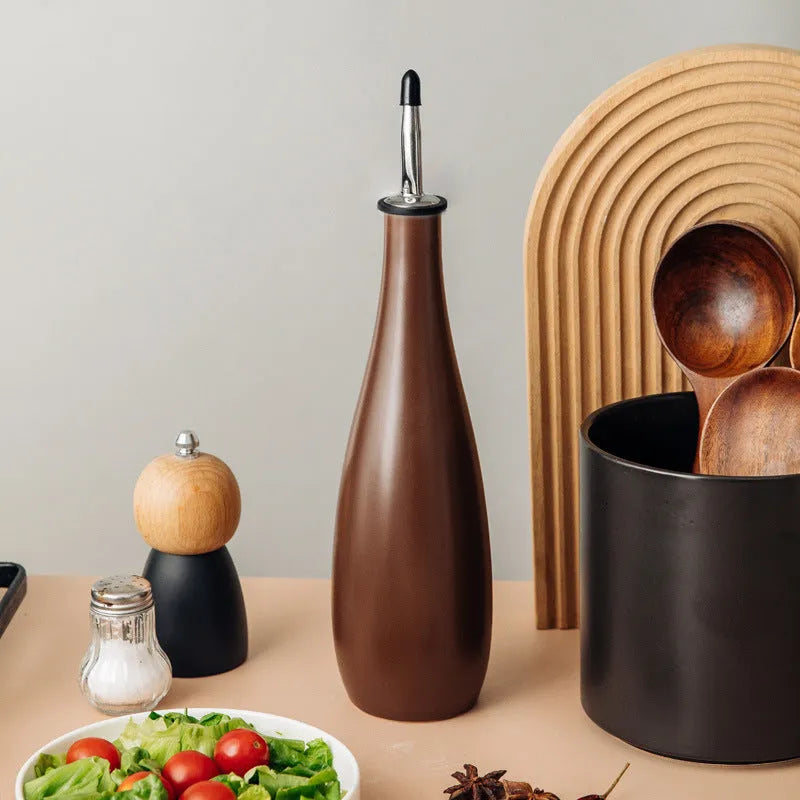 Ceramic oil pot with integrated oil brush and conical funnel design in black, coffee, or white colour