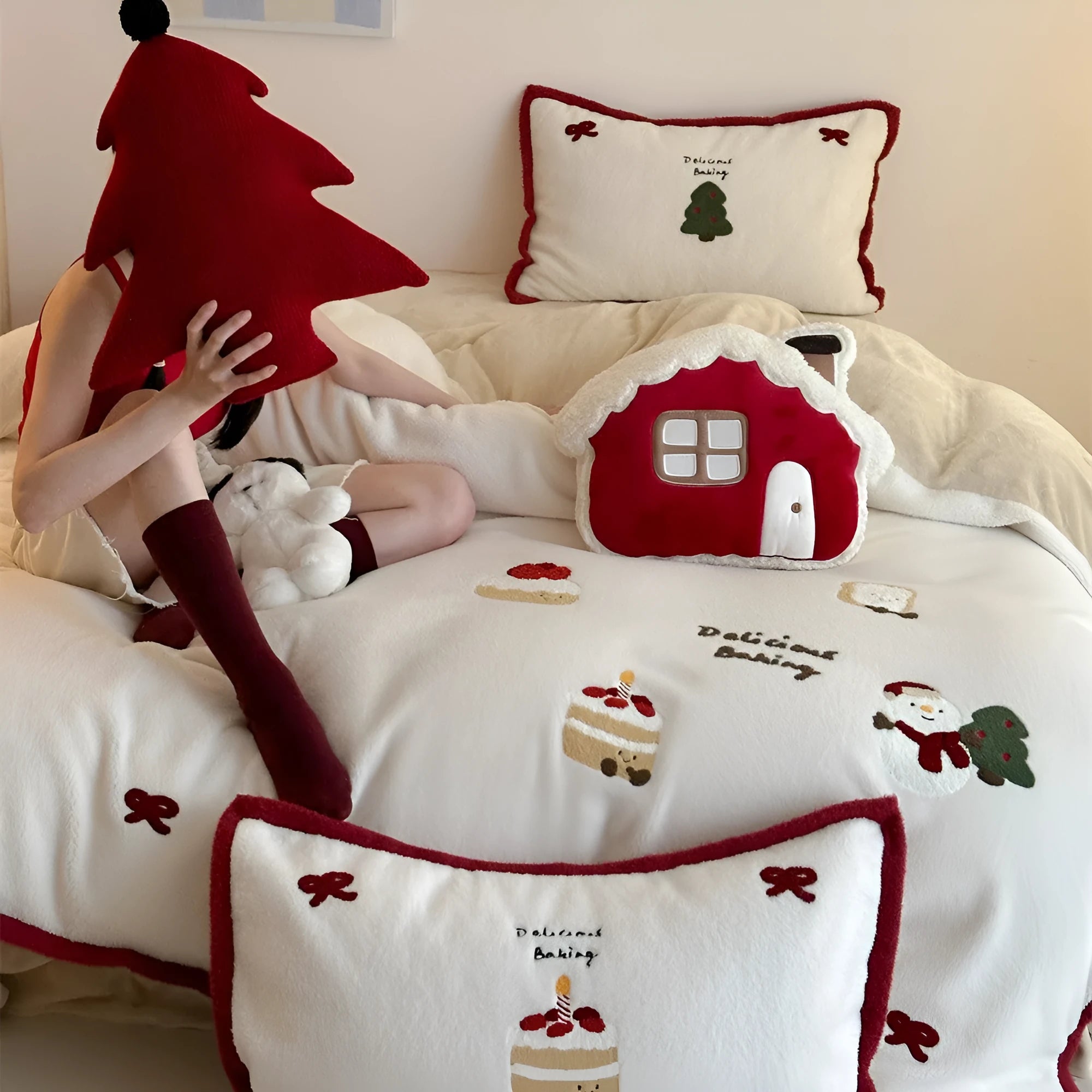 Cartoon Christmas themed bedding four-piece set for children's beds showing bed sheet, pillowcases, and duvet cover