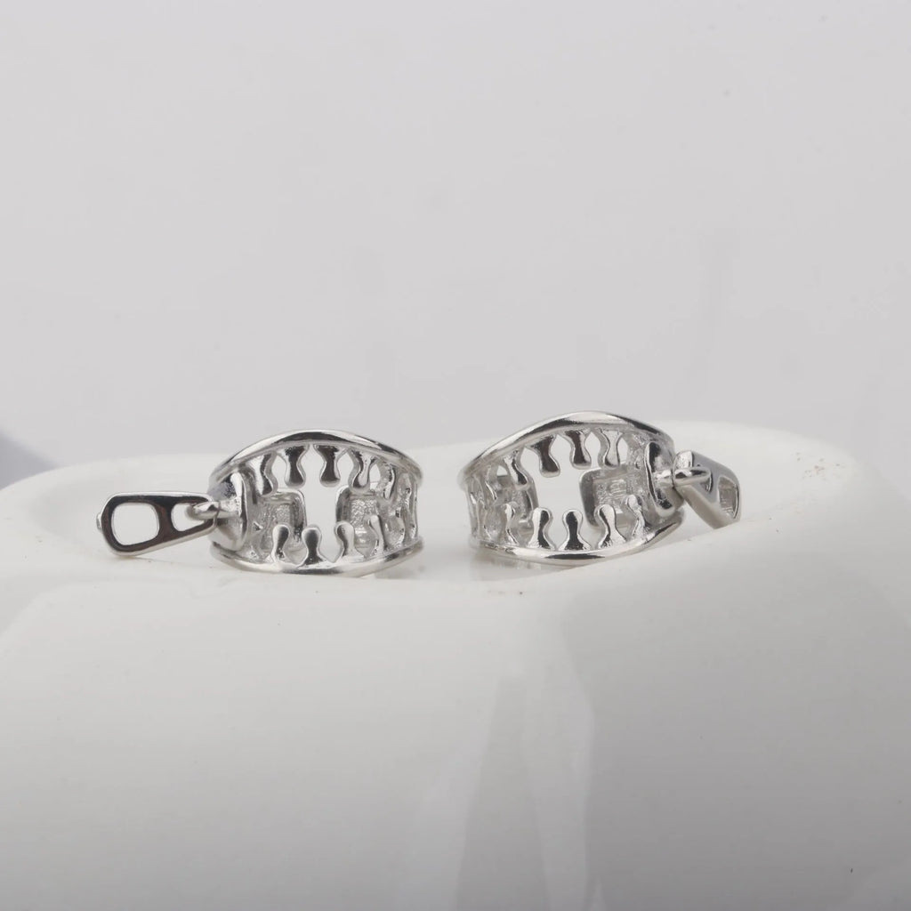 A pair of simple geometric copper ear clips with linear design and a zipper closure, colour ES862.