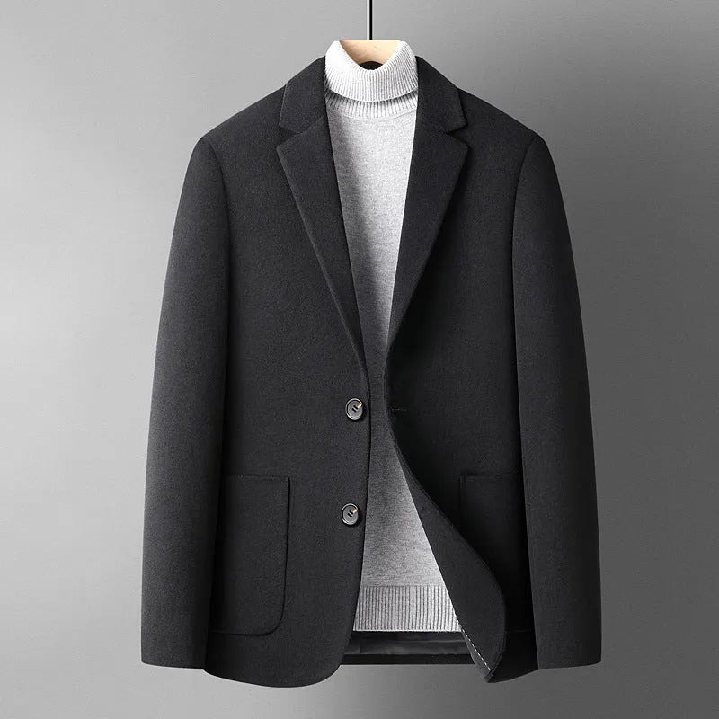 Men's solid colour slim fit wool suit jacket on a hanger.