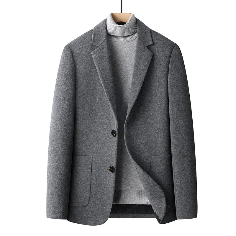 Men's solid colour slim fit wool suit jacket on a hanger.