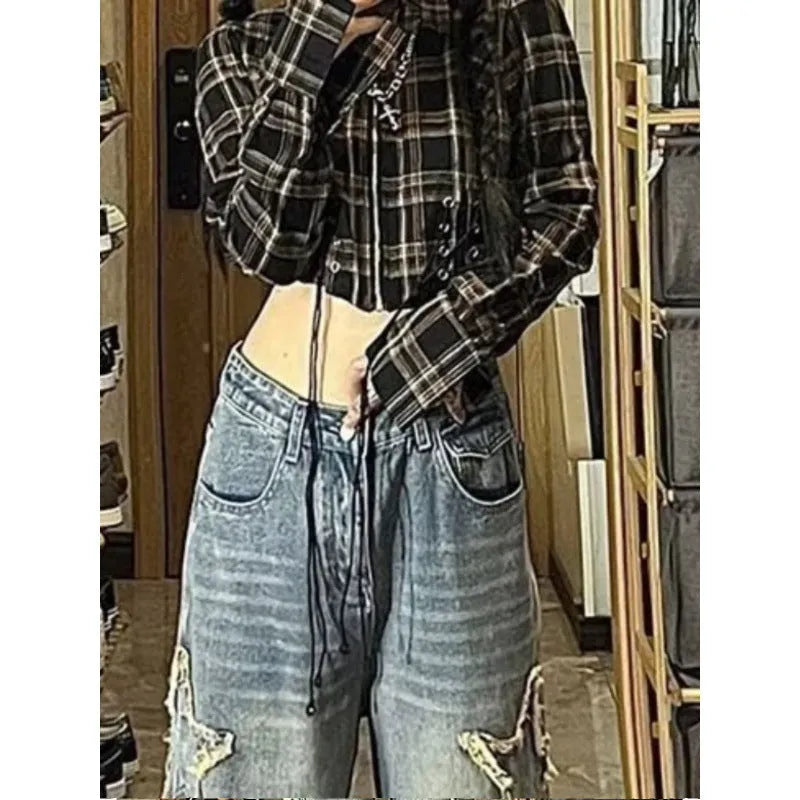 Blue straight-leg high-waist women's denim jeans on a neutral background.