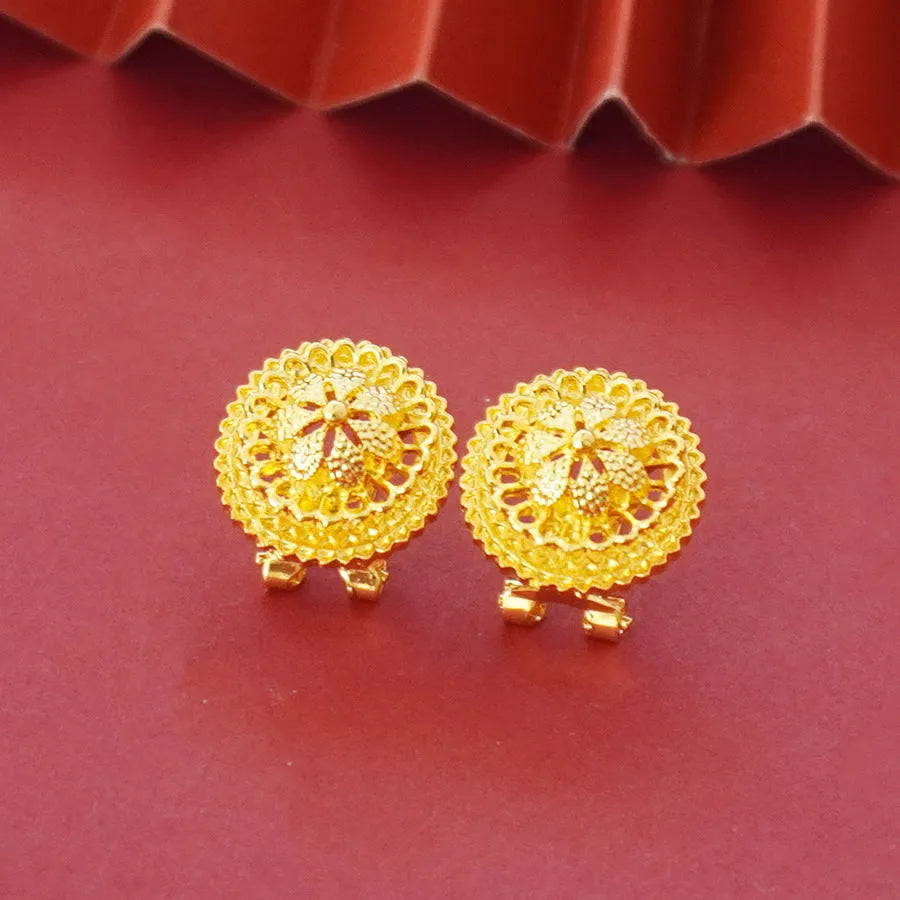 Three-piece gold-plated jewellery set with floral design including pendant necklace, earrings and ring