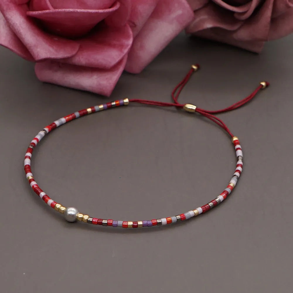 Bohemian style women's bracelet with semi-precious stone and colourful glass beads on adjustable fastening