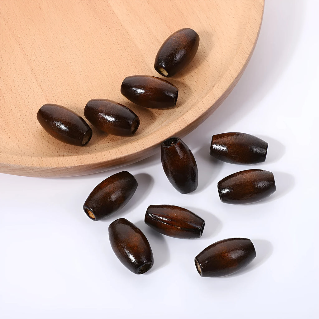 Oval wooden bead M-shaped dark coffee colour 25mm with baking varnish finish on white background