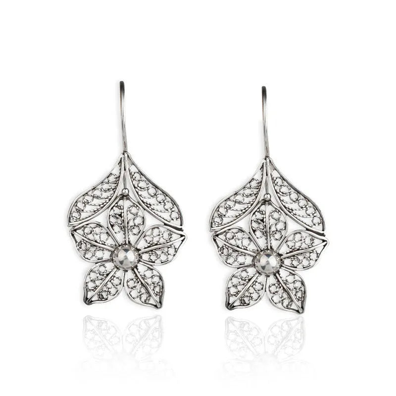 Silver alloy hollow flower and leaf-shaped earrings for women, retro simple design