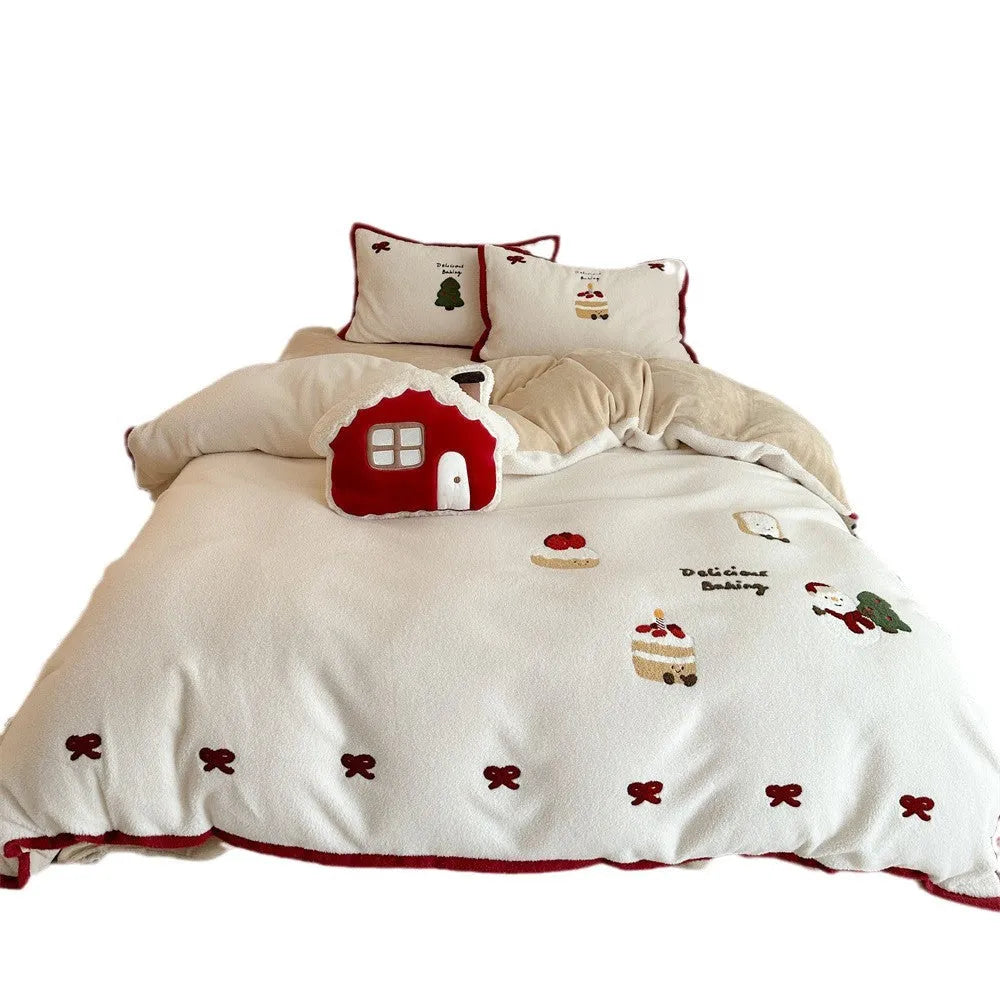 Cartoon Christmas themed bedding four-piece set for children's beds showing bed sheet, pillowcases, and duvet cover