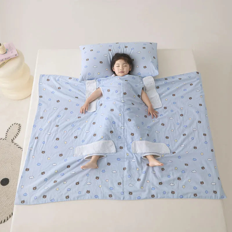 Light blue anti-kick summer blanket with antibacterial filler on a bed