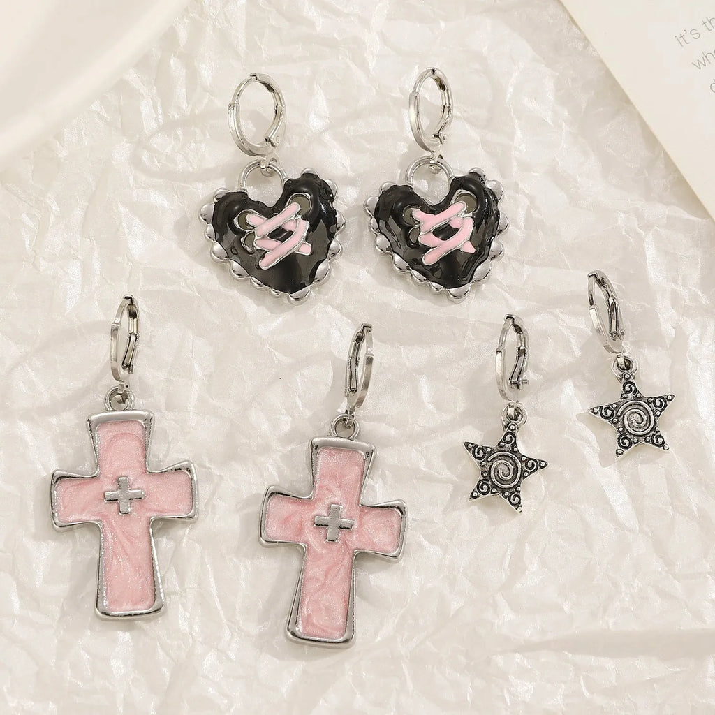 Women's alloy earrings with cross and character designs in five colour options including white cross and antique silver