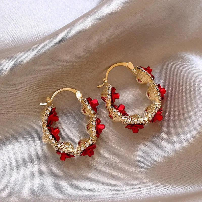 Red alloy clip-on earrings with flower shape and rose-inspired design for women