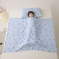 Light blue anti-kick summer blanket with antibacterial filler on a bed