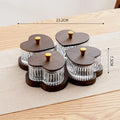 Glass foot bath fruit platter with coloured glaze and transparent heart-shaped lids on a multi-grid snack tray.
