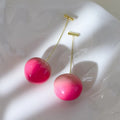 Small and large peach fruit earrings made from acrylic with copper earring findings