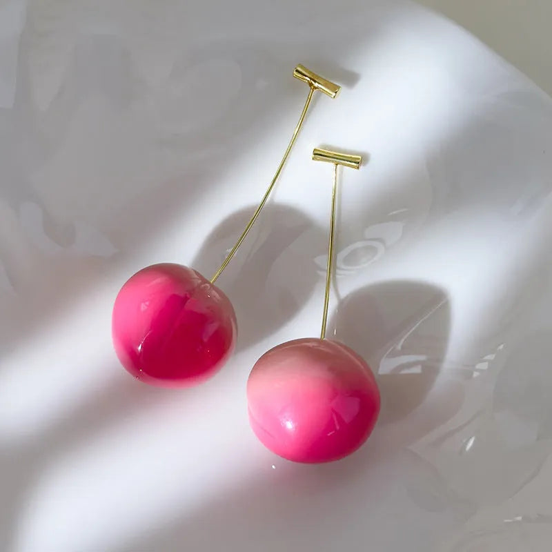Small and large peach fruit earrings made from acrylic with copper earring findings