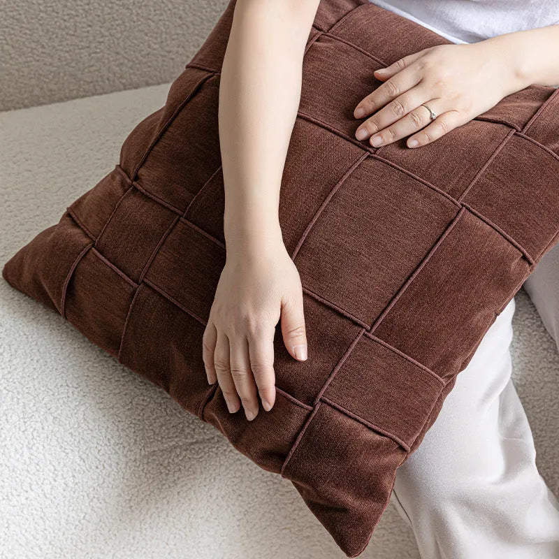 Square chenille woven cushion in a choice of seven colours on a sofa, showing its 50x50cm size and textured fabric.