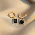 Black geometric copper earrings with zircon stones in French court drop design