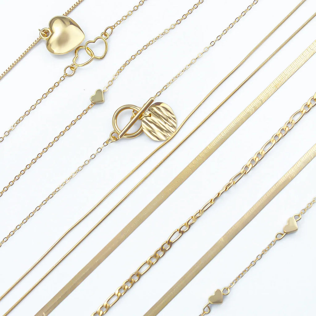 10-piece women's gold electroplated necklace set with adjustable length and snake bone chain design