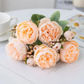 Silk artificial peony flower bouquet in a champagne colour for home or wedding decoration.