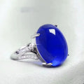 Adjustable geometric sapphire ring in alloy, shown in multiple colour options on a hand.