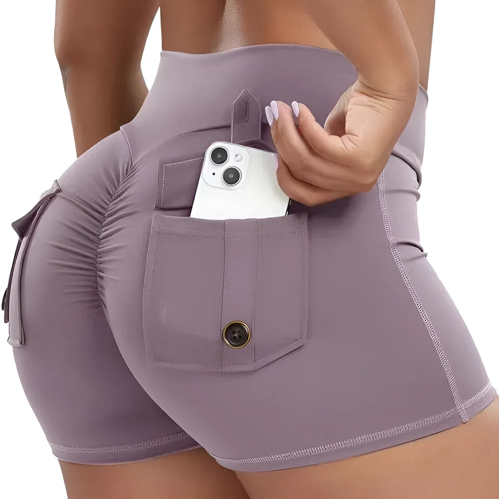 Women's workout shorts with peach hip tight fit in black, front view, for running and yoga