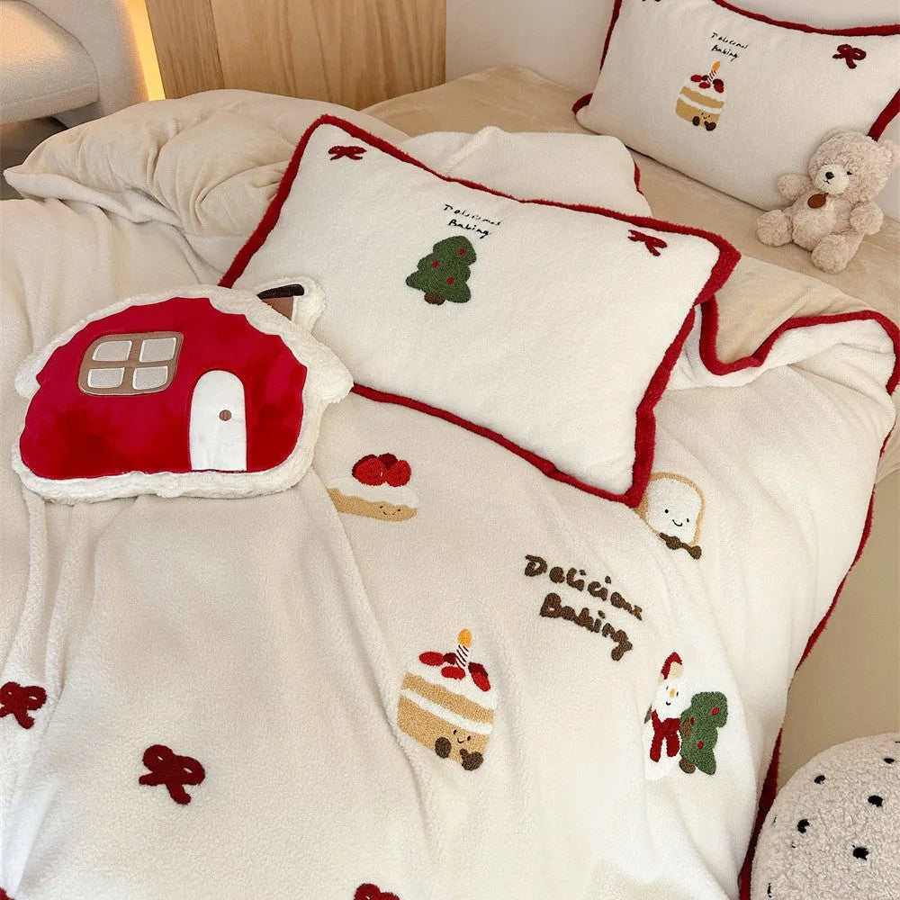 Cartoon Christmas themed bedding four-piece set for children's beds showing bed sheet, pillowcases, and duvet cover