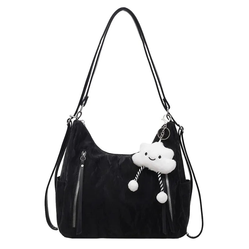 Soft PU women's fashion backpack in beige, shown with attached pendant accessory.