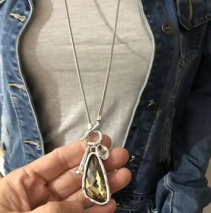 Geometric alloy pendant necklace with snake bones chain in blue, champagne, and grey colour options