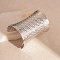 Women's vintage exaggerated round metal bracelet in gold finish with electroplated surface
