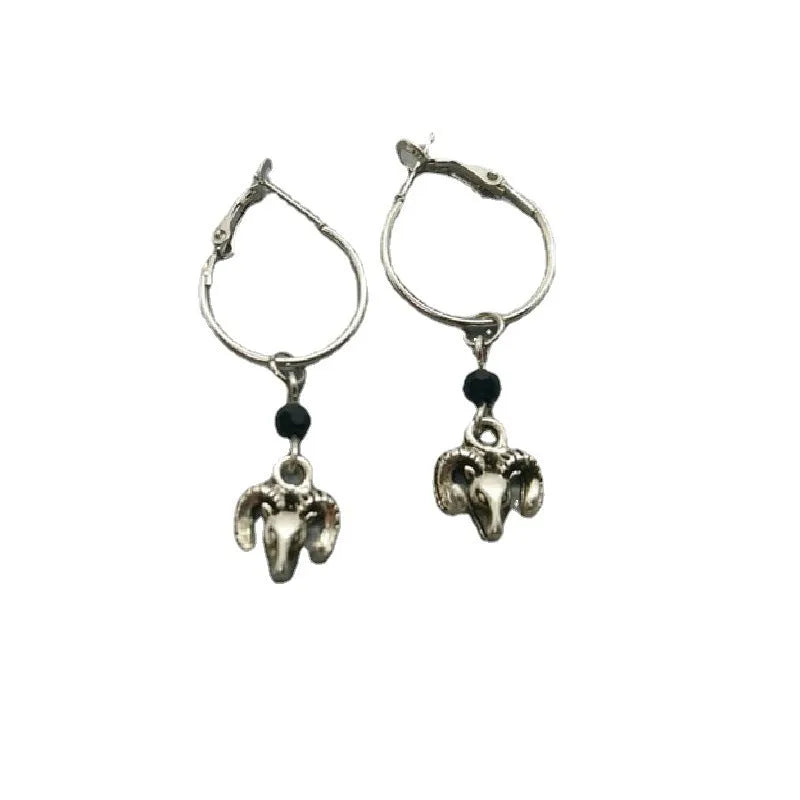 Silver round earrings with Tibetan antelope design inspired by Yunnan high altitude regions
