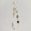Bohemian beaded mobile phone charm in Island Sweetheart colour with alloy chain and decorative beads on a plain background