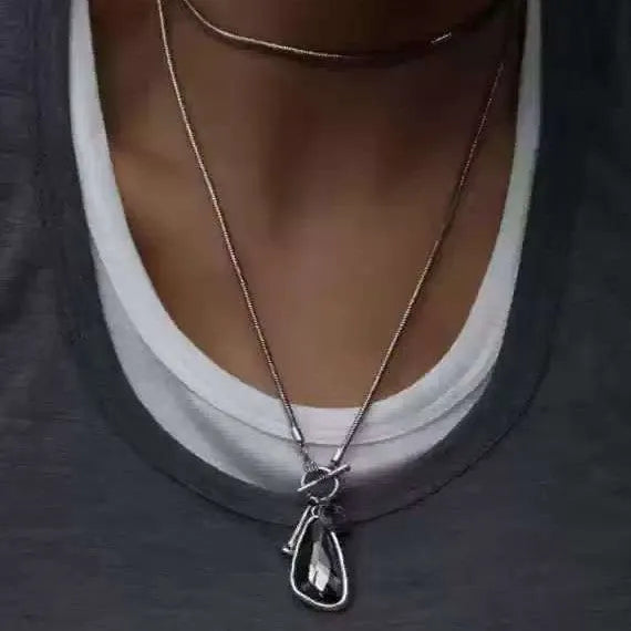 Geometric alloy pendant necklace with snake bones chain in blue, champagne, and grey colour options
