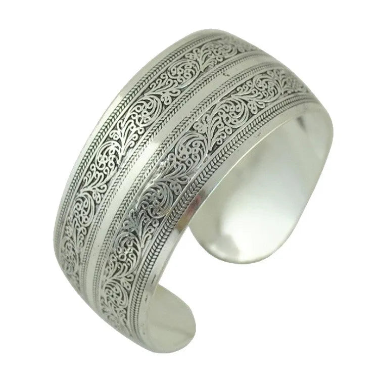 Carved open Miao silver alloy bracelet in Elephant and Turtle colour options with Roman shape
