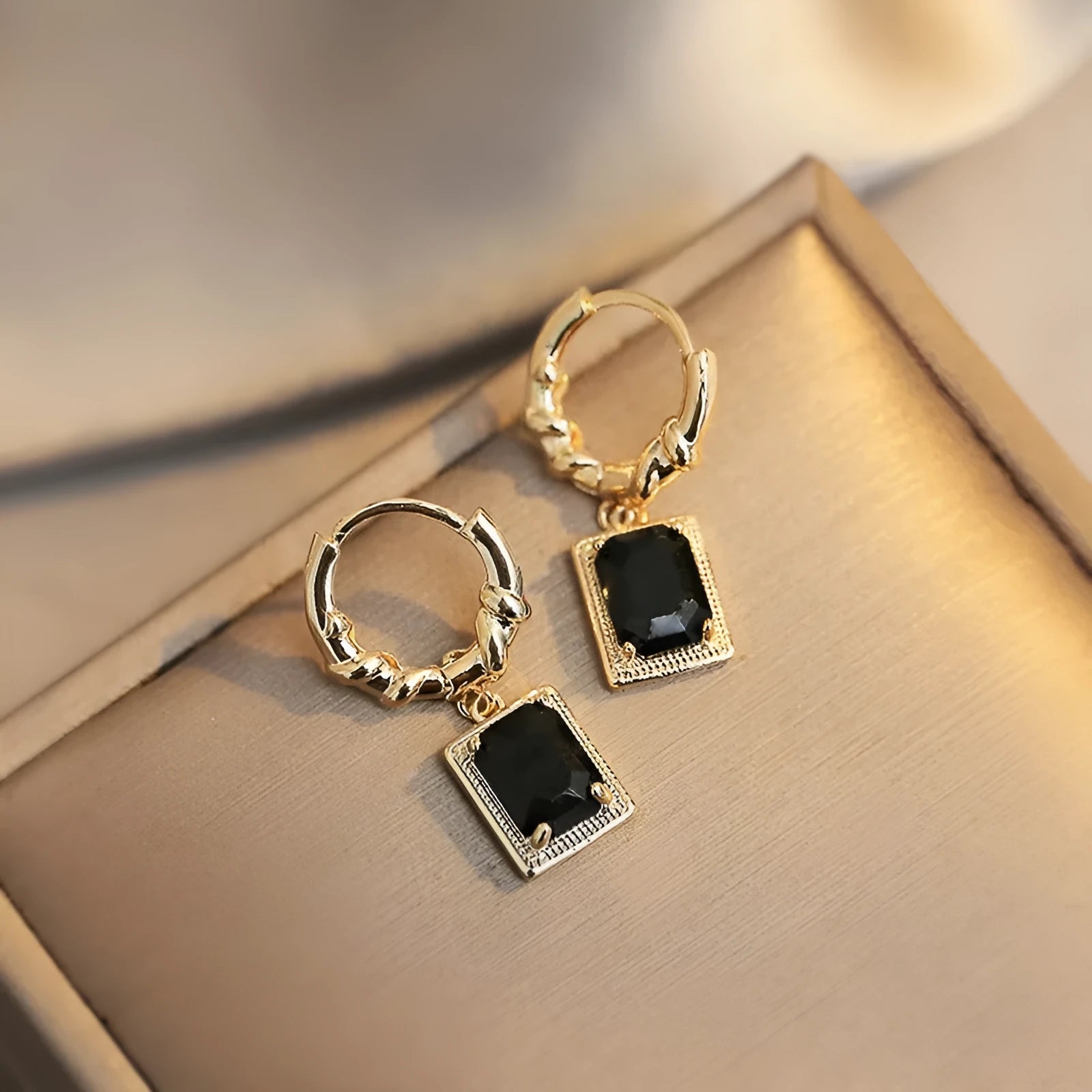 Black geometric copper earrings with zircon stones in French court drop design