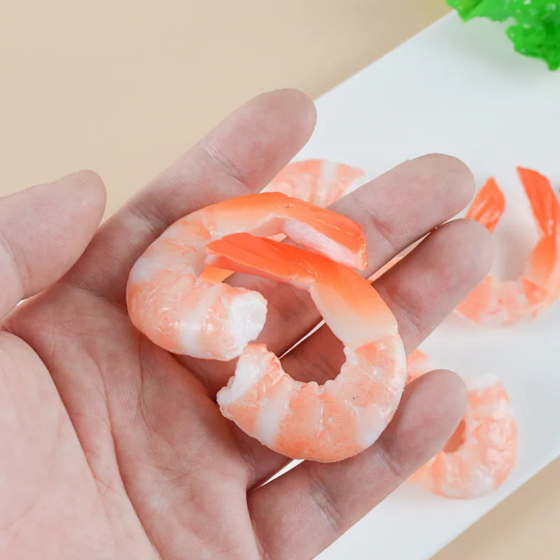 Solid PVC shrimp-shaped keychain with metal loop, 1.5cm thick, modern design.
