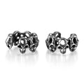 Geometric hollow skull ear clips in stainless steel with electroplated finish