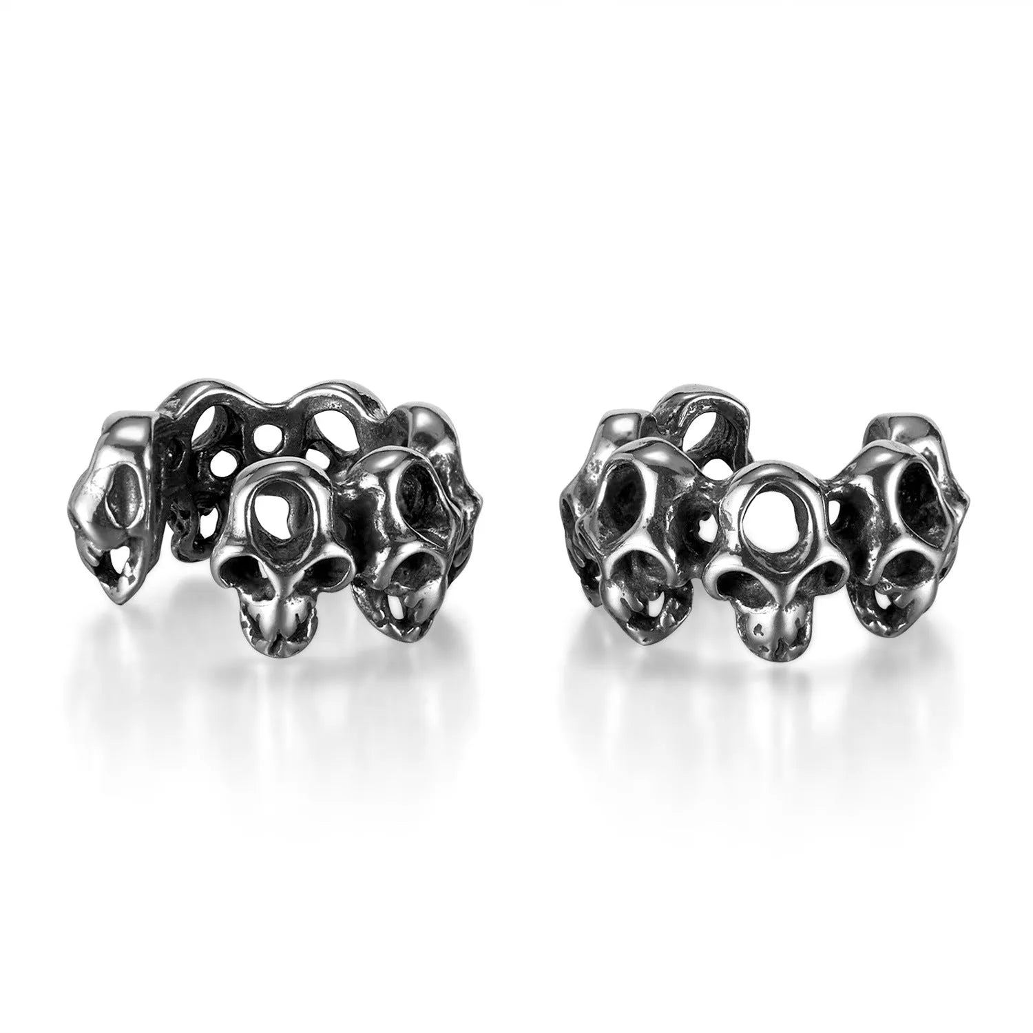Geometric hollow skull ear clips in stainless steel with electroplated finish
